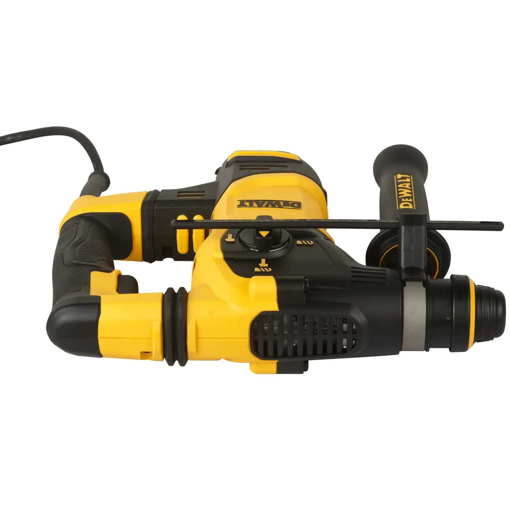 A person wearing a safety helmet and a high-visibility jacket is using a yellow DEWALT power tool to drill into a concrete wall at a construction site.