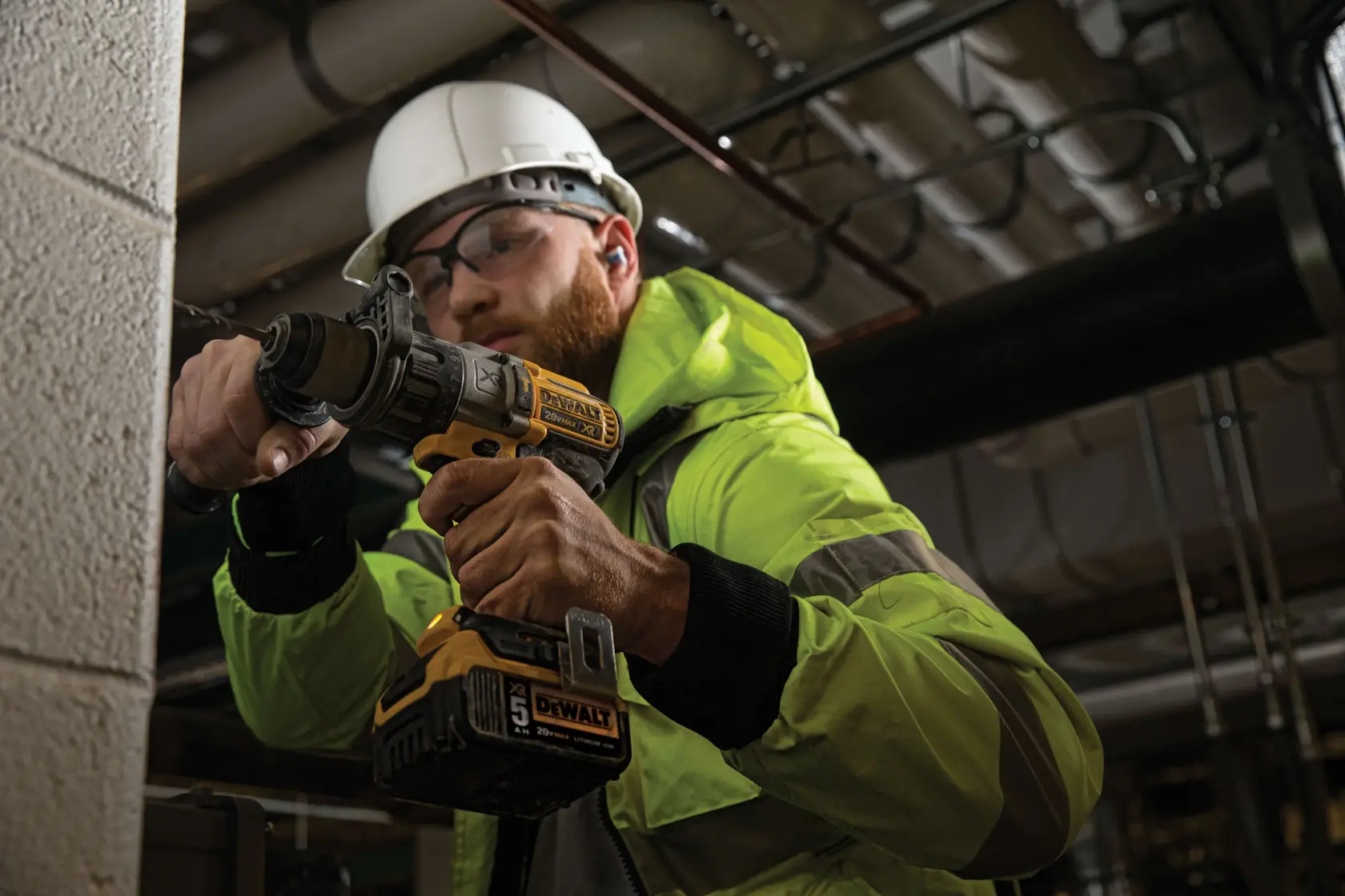 A Dewalt DCD996P2 20V Max XR cordless drill with a yellow and black design and attached 5.0Ah lithium-ion battery, shown against a white background.