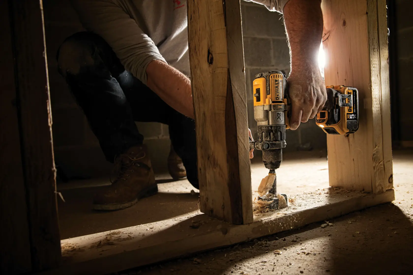 A DEWALT DCD996P2 20V Max XR cordless drill with a black and yellow body, auxiliary handle, and lithium-ion battery pack. The drill features labeling for 5AH, USA construction, and XR technology.